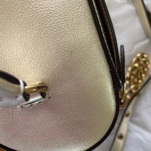 Coach trail bag in quilted, soft, calf leather in light gold. Never used.